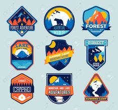 six different badges with mountains and trees