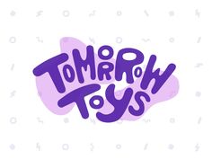 some type of lettering that is purple and has the words'tommy toys'in it