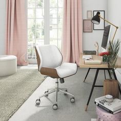 an office with pink curtains and a desk in front of a window, along with a chair