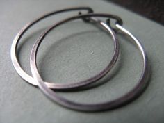 These sterling silver hoop earrings have been hand forged from 18g wire. They're durable and great for everyday wear. They have been oxidized for an antiqued look. They are also available in bright silver, by selecting from the drop down menu. Earrings measure approximately 1 inch (2.5cm) One of the great things about handmade work is that each piece is truly unique, so minor variations from one piece to another is completely normal. Jewelry is packaged and shipped in a lovely jewelry box ready Teardrop Oxidized Hoop Earrings As Gift, Teardrop Oxidized Hoop Earrings For Gift, Gift Oxidized Finish Small Hoop Earrings, Minimalist Oxidized Finish Hoop Earrings As Gift, North Conway Nh, North Conway, Hammered Hoop Earrings, Dog Pendant, Sterling Silver Hoop Earrings