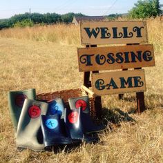 there is a sign that says well tasting game in front of some pieces of wood