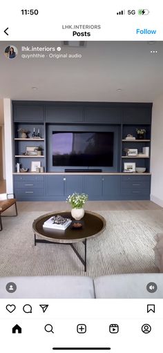 a living room filled with furniture and a flat screen tv on top of a wall