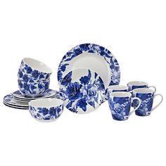 a blue and white dinnerware set with flowers on the plates, cups and saucers