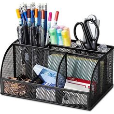 a desk organizer with pens, scissors and other office supplies