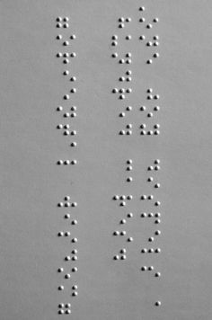 the letters are made up of small white dots