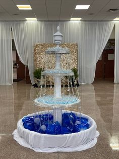 Made from a small pool, balloons, styrofoam, lights, crystals, clear Christmas balls in different sizes and a finial on top. Royal Prom Decorations, Cardboard Fountain Prop, Fake Fountain Prop, A Night In Greece Prom Theme, Italy Prom Theme, Greece Hoco Theme, Royal Ball Prom Theme, Greece Prom Theme, Greek Theme Prom