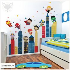 a child's bedroom decorated with superheros and rocket ship wall decals on the walls