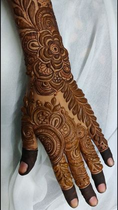 the hand is decorated with intricate designs