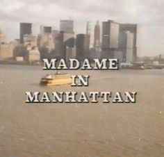 the words madame in manhattan are floating on water