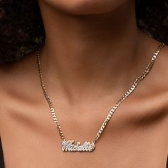 Our popular Double Plated Iced Out Script Name Necklace boasts a chic and elegant design, handcrafted to perfection. The model showcases the necklace with an 18-inch Cuban chain (see image for reference). Chain width:Cuban Chain - 3.7 mmFigaro Chain - 3 mm Closure: All chains are fitted with a lobster clasp. Metal Selection: Gold Plated Silver Plated Sterling silver 14k gold plated over sterling silver 10k solid gold - (NAMEPLATE ONLY)14k solid gold - (NAMEPLATE ONLY) Modern Adjustable Chain Necklace For Anniversary, Metal Name Necklace With Adjustable Chain Pendant, Anniversary Cuban Link Necklace With Adjustable Chain, Anniversary Necklace With Figaro Chain Link, Gold Plated Curb Chain Necklace Gift, Gold Sterling Silver Curb Chain Necklace, Elegant Personalized Chain Link Necklaces, Modern Nameplate Necklace As Gift, Modern Nameplate Necklace For Gift