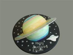 a birthday cake with an image of the planets on it