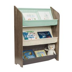 a book shelf with books on it and a stuffed animal next to the top shelf