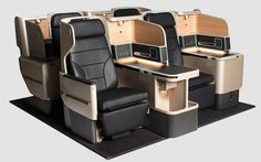 an airplane with several seats and desks on each seat, all in different colors