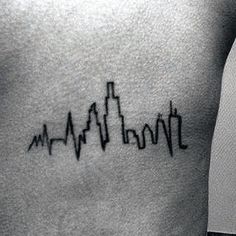 a man with a heartbeat tattoo on his chest that says, i love new york