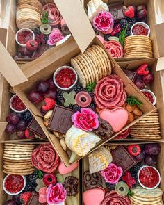 a box filled with lots of different types of food and desserts on top of each other