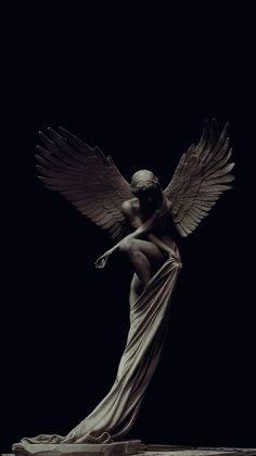 an angel statue with its wings spread out in the air, against a black background