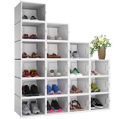 a white shelf filled with lots of shoes