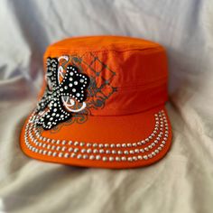 These Hats Are New From Mfg. Beautiful Bling And Stich Work. Each One Has An Adjustable Velcro Back. Color Is True Orange. Trendy Rhinestone Hats For Spring, Casual Cap With Rhinestones, Trendy Summer Hats With Rhinestones, Casual Rhinestone Cap, Casual Rhinestone Hat, One Size Fits Most, Casual Rhinestone Hat, One Size, Casual Rhinestone Hat One Size Fits Most, Casual Rhinestone Hat, Spring Hats With Rhinestones