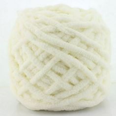 a ball of white yarn on a white background