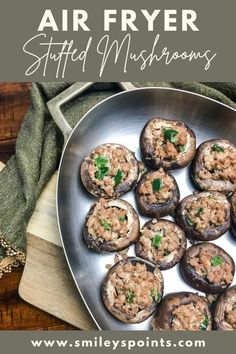 an image of stuffed mushrooms on a plate with text overlay that reads air fryer stuffed mushrooms