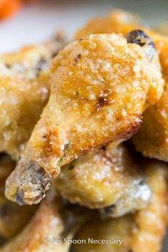 closeup of fried food on a plate with carrots in the background