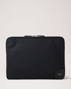 a black purse on a white background