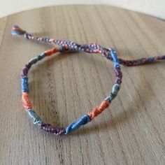 A Handmade Bracelet Or Anklet Woven With Shades Of Orange, Green, And Purple Colors. A Friendship Or Statement Bracelet Perfect For This Summer! Approx. 9 Inches/ 30 Centimeters Long. 10 Woven Bracelets For $25. Everyday Hand-wrapped Blue Friendship Bracelets, Everyday Hand Wrapped Blue Friendship Bracelets, Handmade Orange Friendship Bracelets For Everyday, Orange Handmade Friendship Bracelets, Blue Bohemian Friendship Bracelets For Everyday, Handmade Orange Casual Friendship Bracelet, Casual Handmade Orange Friendship Bracelets, Casual Handmade Orange Friendship Bracelet, Adjustable Orange Bohemian Braided Bracelet