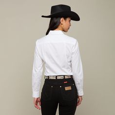 The Dallas is a chic, cotton women's shirt featuring a shirttail hem yoke with a subtle, embroidered mirrored-L emblem on the pocket. Model is 5'10 and wearing size S. Western Style Cotton Workwear Tops, Handcrafted Boots, Handmade Boot, Pocket Model, Women's Shirt, Best Sellers, Dallas, Button Down Shirt, Womens Shirts