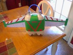 an airplane propaner sitting on top of a wooden table