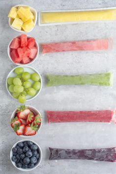 fruit pops are arranged in bowls on a table