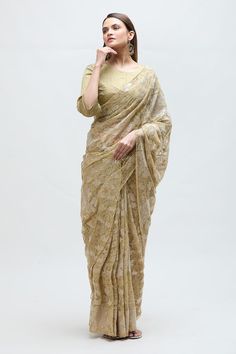 Sand saree featuring floral zari embroidery all over. Paired with a pintuck detailed blouse. - Aza Fashions Brocade Pre-draped Saree With Resham Embroidery, Gold Georgette Pre-draped Saree With Cutdana, Gold Pre-draped Georgette Saree With Resham Embroidery, Festive Brocade Pre-draped Saree With Zari Work, Saree With Unstitched Blouse For Reception, Semi-stitched Wedding Blouse With Chikankari Embroidery, Brocade Pre-draped Saree With Zari Work, Gold Brocade Pre-draped Saree With Zari Work, Designer Wear Pre-draped Saree With Self Design For Navratri