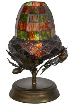 a stained glass lamp on a metal base