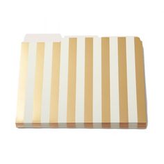 a white and gold striped cutting board on a white background with clipping for text