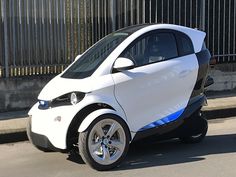 an electric car is parked on the street