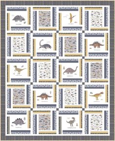 a quilt with dinosaurs and other animals on it