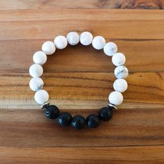 "This bracelet features beautiful matte white howlite gemstones, lava stones, and silver accent beads. Made with high quality elastic cord and 10mm beads. Perfect for a man or a woman! *To use as a diffuser bracelet, apply a drop or two of 100% pure essential oil to the lava stones. The scent will last for 1-2 days. Please message me if you would like more information about essential oils. White Howlite Healing Properties: Happiness, Calming, Stress Relief MEASURING YOUR WRIST FOR AN ACCURATE BR White Howlite Bracelets With Natural Stones, White Howlite Spiritual Bracelets, White Gemstone Beads Stretch Bracelet For Everyday, White Stretch Bracelet With Gemstone Beads For Everyday, White Stretch Bracelet With Gemstone Beads, White Gemstone Beads Stretch Bracelet, Everyday White Gemstone Beads Stretch Bracelet, Casual White Stretch Bracelet With Gemstone Beads, Casual White Beaded Bracelets With Natural Stones