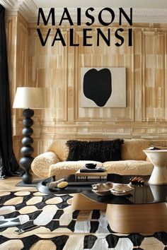 the cover of maison valensi magazine shows a living room with black and white furniture