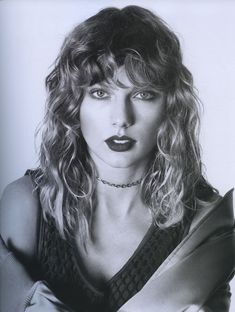 a black and white photo of a woman with long hair