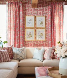 a living room filled with furniture and flowers