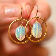 Pinfire Golden Hoop earrings matched with two gorgeous opals that are a green misty hue. These really bring a fun look to any outfit. Golden Hoops - Gold Vermeil (over .925 sterling silver) Ethiopian Opals - 14 x 9 mm 14 K Gold Filled Ear Wire Length: 1 1/4” Small Hoop Opal Earrings For Gift, Opal Hoop Earrings As A Gift, Gold Opal Hoop Jewelry, Gold Hoop Opal Jewelry, Oval Opal Jewelry With Matching Earrings, Everyday Opal Jewelry With Gemstones, Everyday Opal Gemstone Jewelry, Minimalist Ethiopian Opal Round Jewelry, Hypoallergenic Opal Drop Earrings