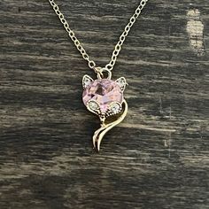 Gold Colored Clasp Necklace With Pink Cubic Zirconia Fox/Cat Head And Tail. Super Cute To Pet Your Significant Other Know How You Feel About Them. The Chain Clasped Is 10”. I’m Not Sure What The Real Material Is. Pink Rhinestone Clavicle Chain Necklace, Pink Clavicle Chain Rhinestone Necklace, Elegant Pink Rhinestone Necklace Gift, Elegant Pink Rhinestone Necklace For Gift, Pink Gemstone Necklace, 32 Necklace, Fox Tail, Pink Fox, Silver Bead Necklace