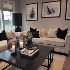 a living room with two couches and a coffee table in front of a window