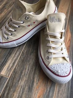 Embroidered Converse with Pearls on the toes and Bling on heel strip! Getting Married? What a great idea. This listing is for Mrs on the tongue and with date on the side ! I will use the font shown unless you message me with your requests! You choose your thread colors, I have hundreds of colors, just let me know Other options available in my shop!! Wear these at your reception so your feet don't hurt. You can do white to match your dress or coordinate with your bridal party. You can even get ea Embroidered Round Toe Wedding Shoes, Cream Round Toe Wedding Shoes For Bride, Converse With Pearls, Groom Shoes Wedding, Sneakers Wedding, Embroidered Sneakers, Embroidered Converse, Low Top Converse, Converse Low Tops