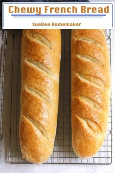 two loaves of bread sitting on top of a cooling rack next to each other