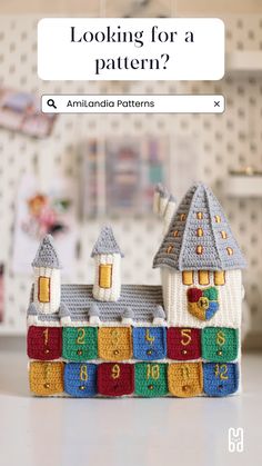 a toy house made out of crochet with the text looking for a pattern?