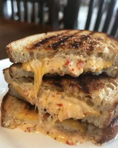 two grilled cheese sandwiches stacked on top of each other