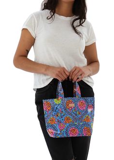 The Mini Bag was made for the little moments- carrying keys and a snack for a walk on the beach, lunch and a cold brew to the office, or for waiting patiently in the car, folded neatly under your seat. This bag made of easy-to-clean ConsuelaCloth™ is the smallest of our colorful utility totes. DETAILS & SIZING Mandy ConsuelaCloth™ exterior Diego natural leather logo accent Unlined interior Base insert for stability 8 ½” (W at the base), 11 ½” (W at the top) x 8 ½” (H) x 4” (D), 5 ½" handle drop Blue Tote Lunch Bag For Travel, Blue Rectangular Lunch Bag For Daily Use, Casual Blue Lunch Bag For Travel, Casual Blue Travel Lunch Bag, Blue Rectangular Everyday Lunch Bag, Everyday Blue Rectangular Lunch Bag, Rectangular Blue Lunch Bag, Daily Use Blue Recyclable Bags, Reversible Blue Bag For On-the-go