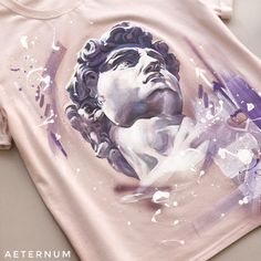 a t - shirt with an image of a man's head painted on it