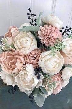 a bouquet of flowers sitting on top of a table