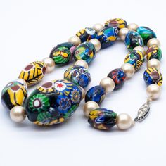 Original Art Deco Trade Beads Millefiori Venetian Glass Necklace in good used condition. Would benefit from restringing, faux pearl spacers, white metal clasp. Approximate Dimensions - graduated from14mm x 10mm to 30mm x 20mm, length 45 cm / 17.75 inches Weight - 70.80 grams Era - C1920s Hallmarks - N/a All gemstones in my listings have been examined and verified by Gemmologist Kate Matthews FGA. All pieces are in original vintage/antique condition. I'm happy to clean/polish upon buyers request Venetian Glass, Trade Beads, Glass Necklace, I'm Happy, White Metal, Vintage Art Deco, Antique Vintage, Faux Pearl, Vintage Art